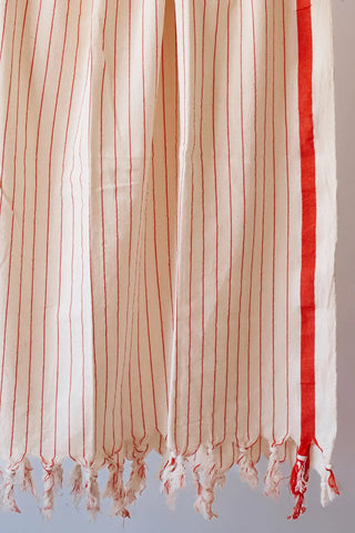 Red luxury striped peshtemal towel fringe detail closeup. Handwoven Turkish cotton Denizli, OEKO-TEX. Vivamaison.