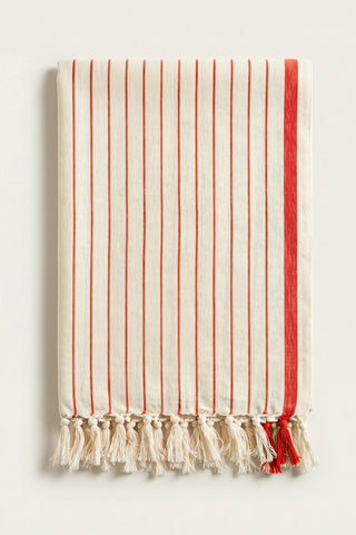 Luxury striped Turkish cotton peshtemal towel in red, folded front view with side band and knotted fringe