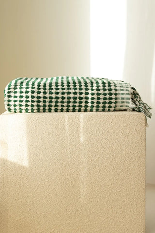 Green White handwoven Turkish cotton pom pom woven towel set folded. Tasseled fringe Denizli, OEKO-TEX. Vivamaison.