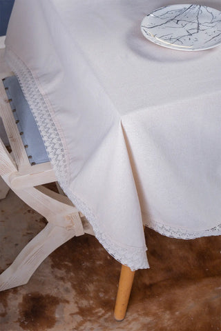 Natural handwoven raw linen lace tablecloth corner detail. Hand-crocheted lace border, Denizli, OEKO-TEX. Vivamaison.