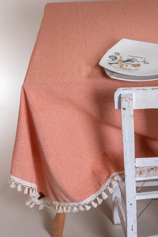 Orange handwoven solid color Turkish cotton tassel tablecloth overhead. Tasseled edges Denizli, OEKO-TEX. Vivamaison.