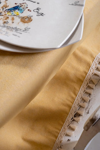 Yellow handwoven solid color Turkish cotton tassel tablecloth overhead. Tasseled edges Denizli, OEKO-TEX. Vivamaison.