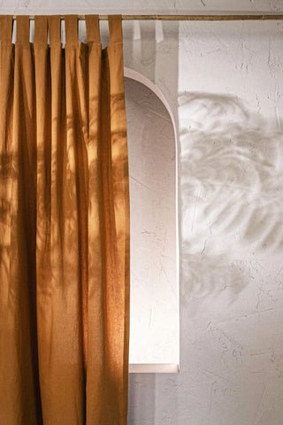 Terracotta stonewashed cotton curtain panel with leaf shadows. Handwoven in Denizli, OEKO-TEX. Vivamaison.
