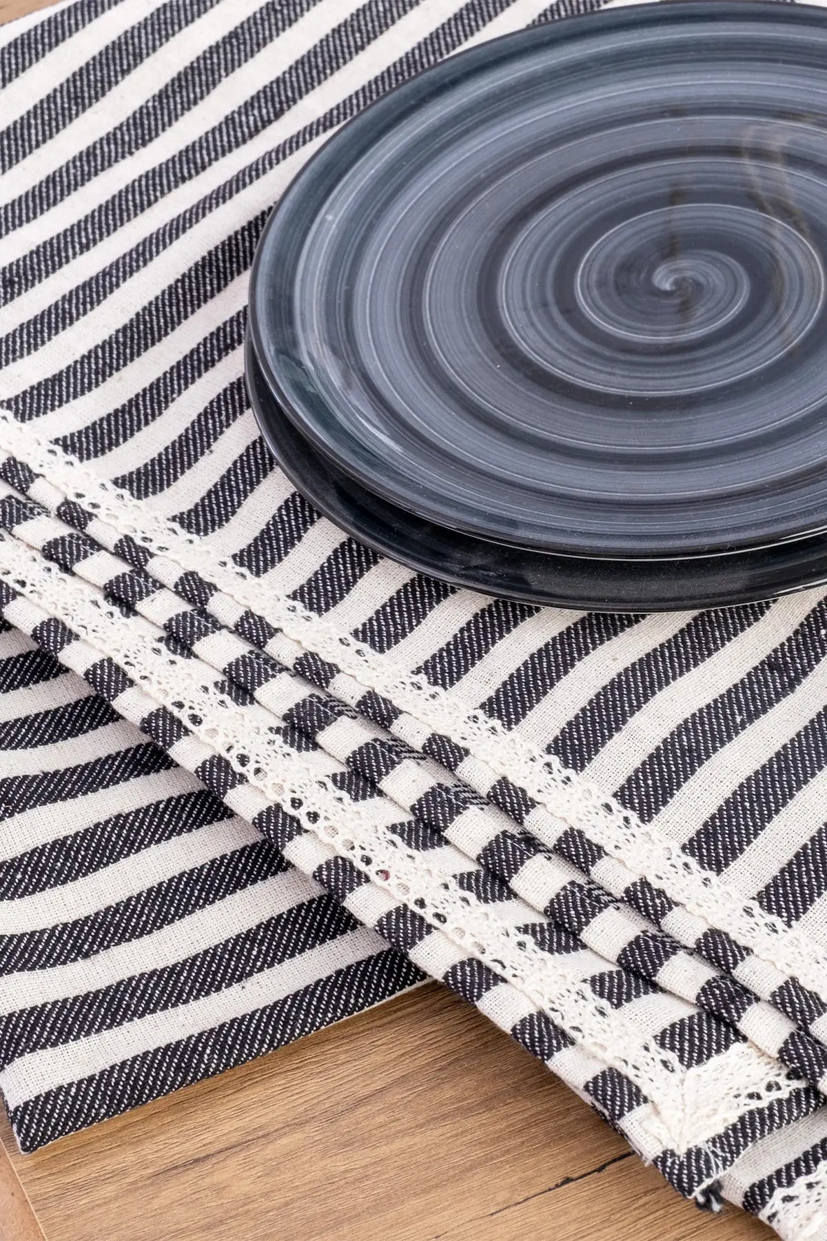 Grey handwoven striped linen lace cotton tablecloth draped detail. Crocheted lace Denizli, OEKO-TEX. Vivamaison.