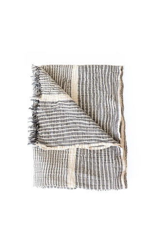 Black striped peshtemal towel folded flat lay. Handwoven Turkish cotton Denizli, OEKO-TEX. Vivamaison.