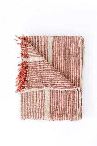 Red striped peshtemal towel folded flat lay. Handwoven Turkish cotton Denizli, OEKO-TEX. Vivamaison.