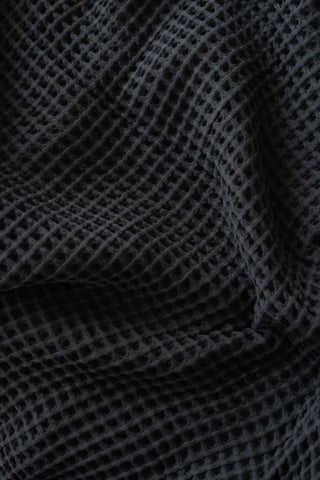Black handwoven Turkish cotton waffle weave bedspread detail. 350 GSM Denizli, OEKO-TEX. Vivamaison.
