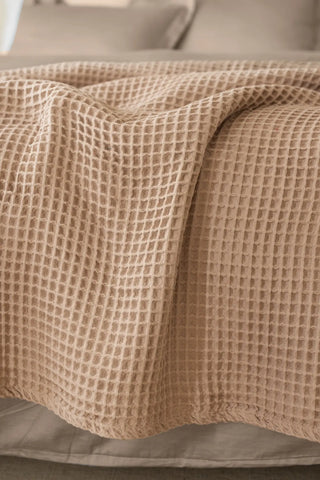 Brown handwoven Turkish cotton waffle weave bedspread folded flat lay. 350 GSM Denizli, OEKO-TEX. Vivamaison.