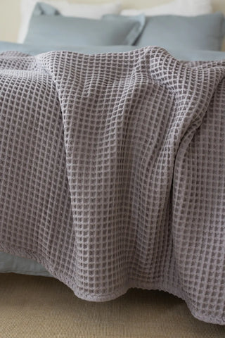 Grey handwoven Turkish cotton waffle weave bedspread folded flat lay. 350 GSM Denizli, OEKO-TEX. Vivamaison.