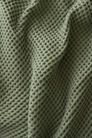 Sage Green handwoven Turkish cotton waffle weave bedspread lifestyle. 350 GSM Denizli, OEKO-TEX. Vivamaison.