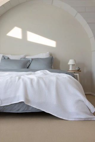 White handwoven Turkish cotton waffle weave bedspread lifestyle. 350 GSM Denizli, OEKO-TEX. Vivamaison.