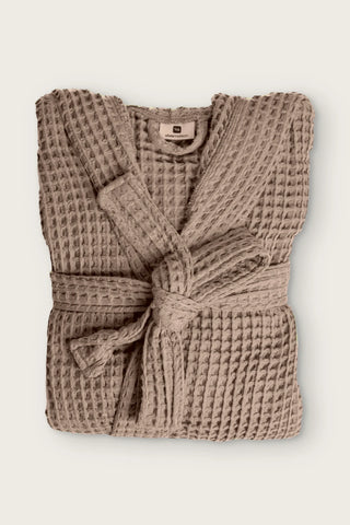 Handwoven waffle hooded bathrobe in brown, folded front view with tied belt