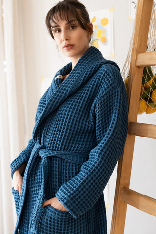 Indigo blue waffle hooded bathrobe with hood up, closeup. Handwoven Turkish cotton Denizli, OEKO-TEX. Vivamaison.