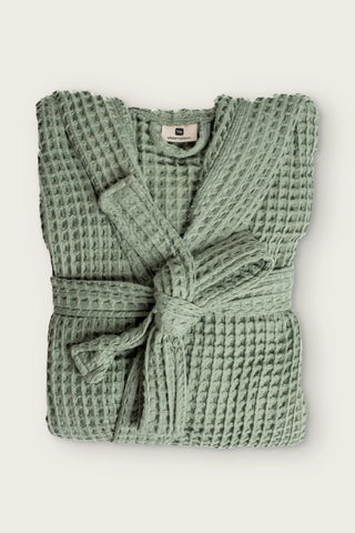 Handwoven waffle hooded bathrobe in sage green, folded front view with tied belt