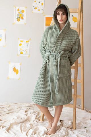 Sage green waffle hooded bathrobe with hood up, handwoven Turkish cotton. Denizli artisan weave, OEKO-TEX. Vivamaison.