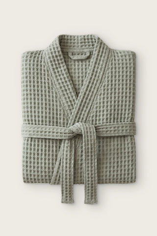 Handwoven waffle kimono bathrobe in sage green, folded front view with tied belt