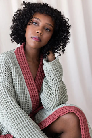 Sage Green Burgundy handwoven waffle two-tone kimono bathrobe portrait sitting. Handwoven Denizli, OEKO-TEX. Vivamaison.