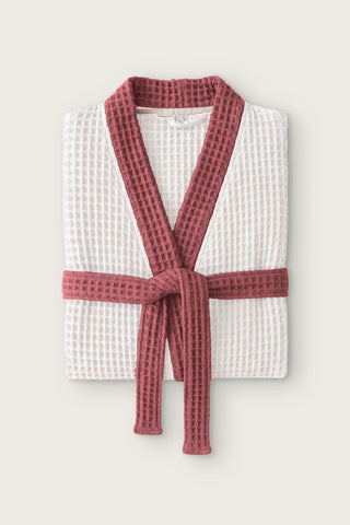Handwoven two-tone waffle kimono bathrobe in white - burgundy, folded front view with contrast collar and tied belt