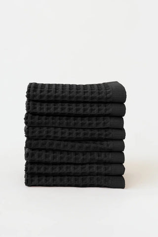 Black handwoven Turkish cotton waffle weave towel set of 8 washcloths stacked. Denizli, OEKO-TEX. Vivamaison.