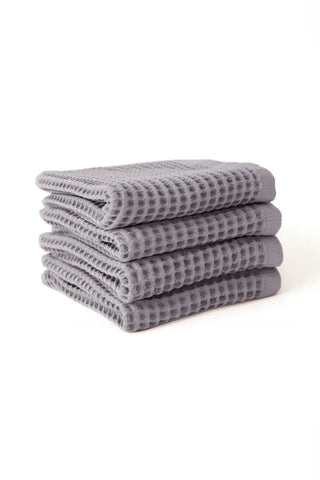 Grey handwoven Turkish cotton waffle weave towel set of 4 hand towels stacked. Denizli, OEKO-TEX. Vivamaison.