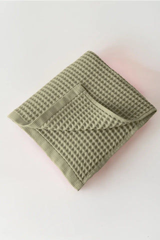 Sage Green handwoven Turkish cotton waffle weave towel bath towel folded detail. Denizli, OEKO-TEX. Vivamaison.