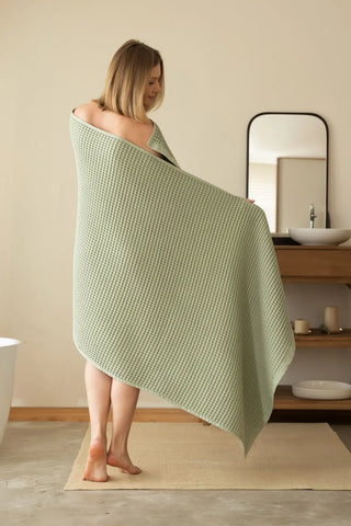 Sage Green handwoven Turkish cotton waffle weave towel lifestyle back view. Denizli, OEKO-TEX. Vivamaison.