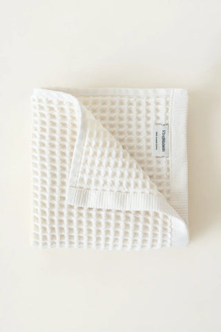White handwoven Turkish cotton waffle weave towel set of 4 hand towels stacked. Denizli, OEKO-TEX. Vivamaison.