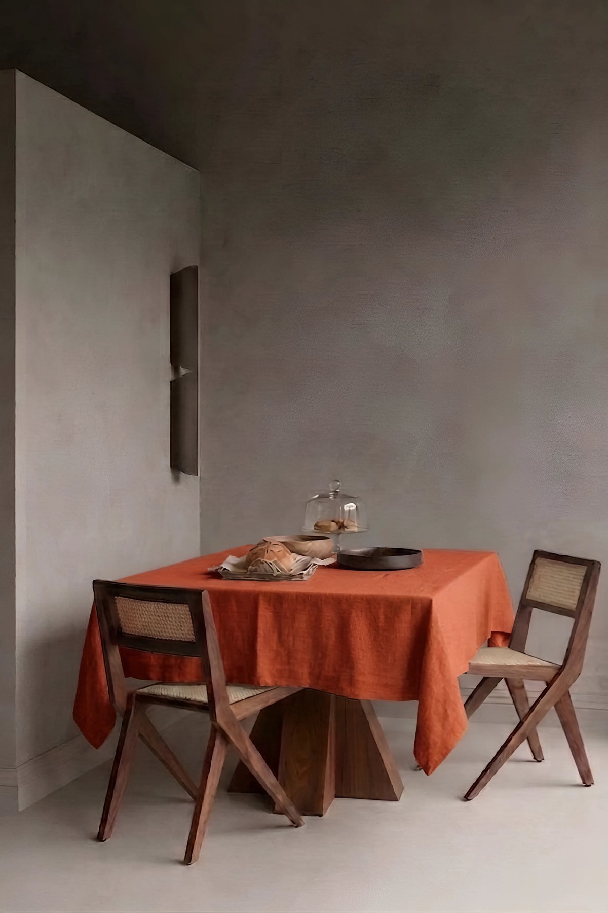 Cinnamon plain linen cotton blend tablecloth on a dining table in a modern dining room with cane chairs. 9 sizes, handmade in Denizli, OEKO-TEX. VivaMaison.