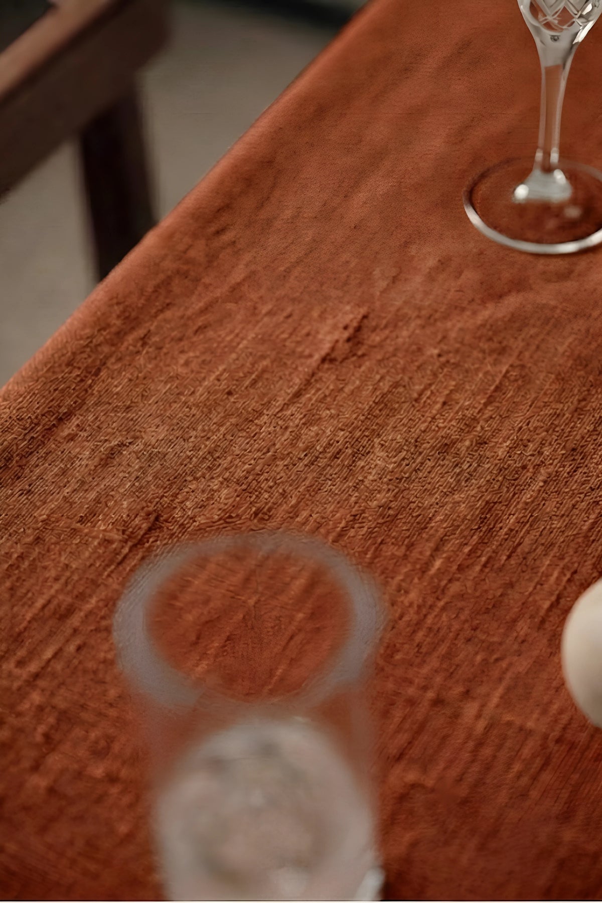 Cinnamon ruffled linen cotton blend tablecloth fabric texture close-up with a wine glass. 9 sizes, handmade in Denizli, OEKO-TEX. VivaMaison.
