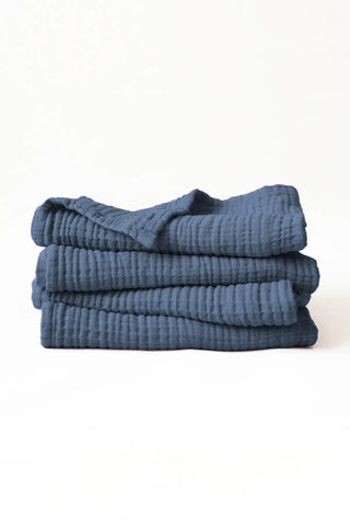 Stacked indigo blue muslin Turkish cotton towels with soft 4-layer gauze weave, handwoven in Denizli