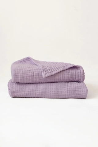Lilac handwoven muslin towel in a styled bathroom setting, OEKO-TEX certified VivaMaison Turkish cotton
