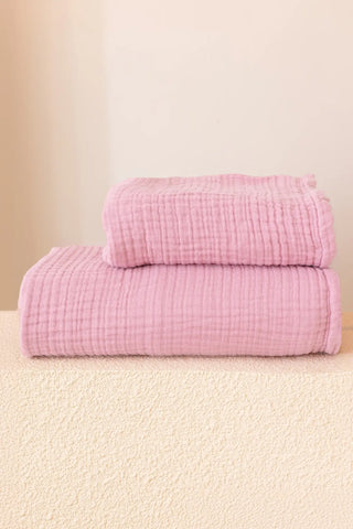 Pink muslin Turkish towel in a soft home scene, handwoven OEKO-TEX certified VivaMaison cotton