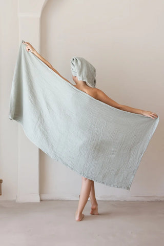 Close-up of sage green muslin gauze weave on a handwoven Turkish cotton towel from VivaMaison Denizli
