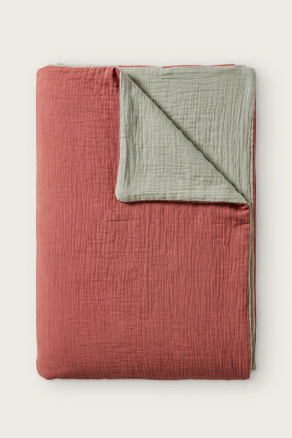 Reversible two-tone muslin duvet cover in terracotta / sage green, folded view showing both sides