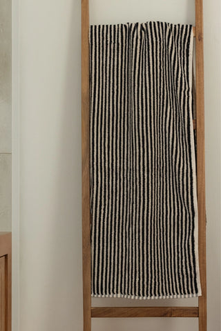 Black striped Turkish cotton bath sheet hanging on a wooden ladder - VivaMaison