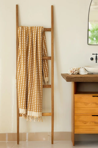 Mustard Turkish cotton mosaic towel hanging on a wooden ladder - VivaMaison