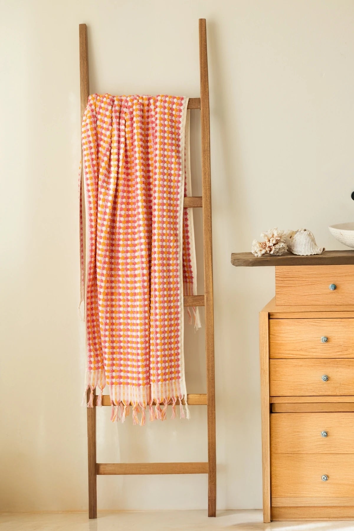 Orange Pink Turkish cotton mosaic towel hanging on a wooden ladder - VivaMaison