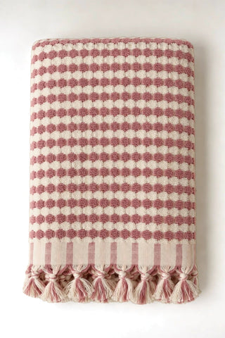 Pink Turkish cotton mosaic towel folded front view with bobble texture and knotted fringe - VivaMaison