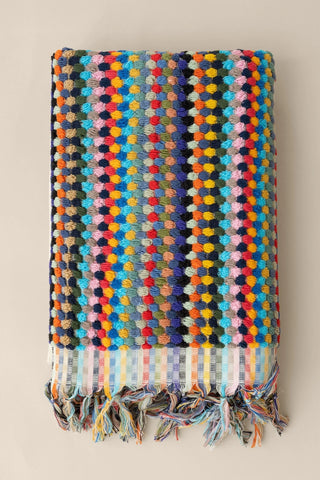 Rainbow Turkish cotton pom pom towel folded front view with bobble texture and knotted fringe - VivaMaison