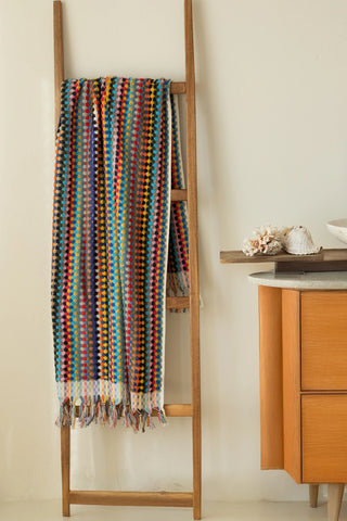 Rainbow Turkish cotton pom pom towel hanging on a wooden ladder - VivaMaison