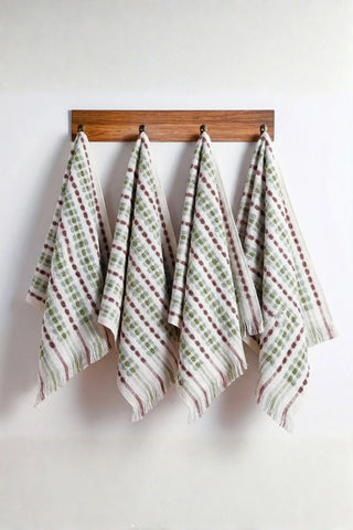 Sage Brown Turkish cotton pom pom towel hanging on wall hooks - VivaMaison