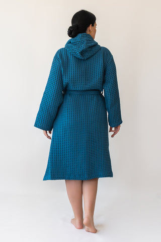 Indigo Blue waffle cotton bathrobe showing hooded design and honeycomb weave texture